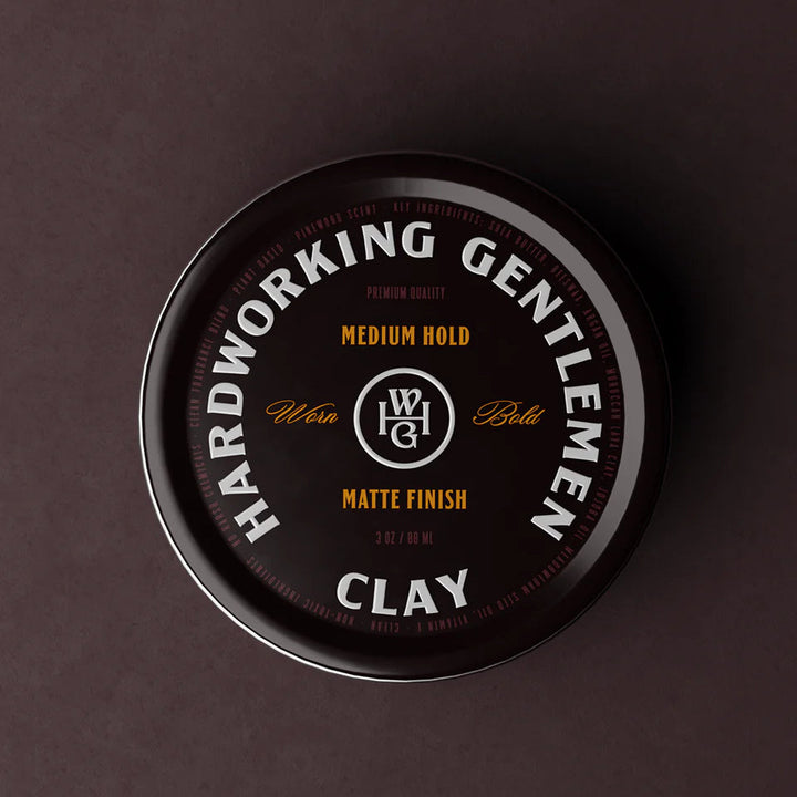 Container of Hardworking Gentlemen clay on a dark background