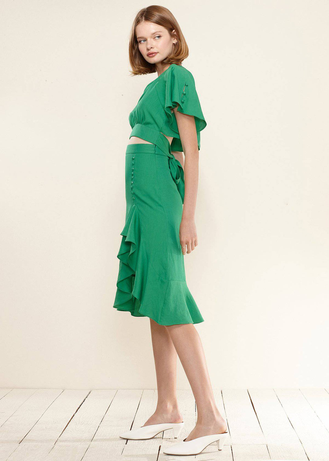 Women's Asymmetrical Hem Button Front Skirt in Kelly Green by Shop at Konus