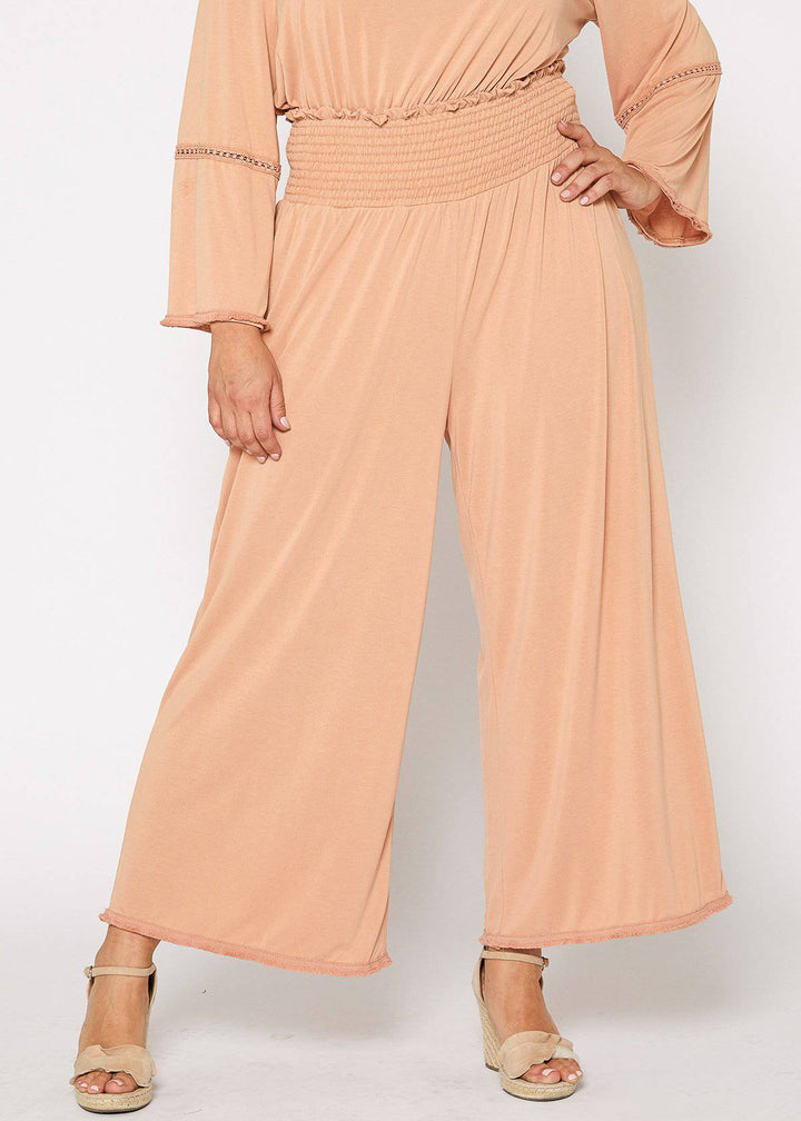 Plus Size Smocked Waist Wide Leg Palazzo Pants in Apricot by Shop at Konus