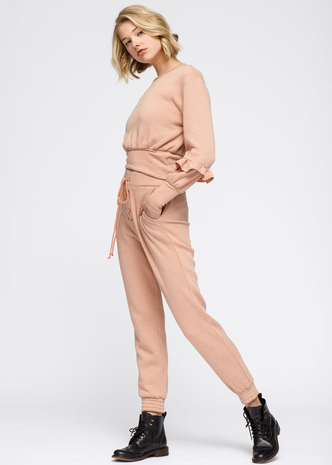 Crewneck Ruffle Sleeve Peplum Sweatshirt In Peach by Shop at Konus