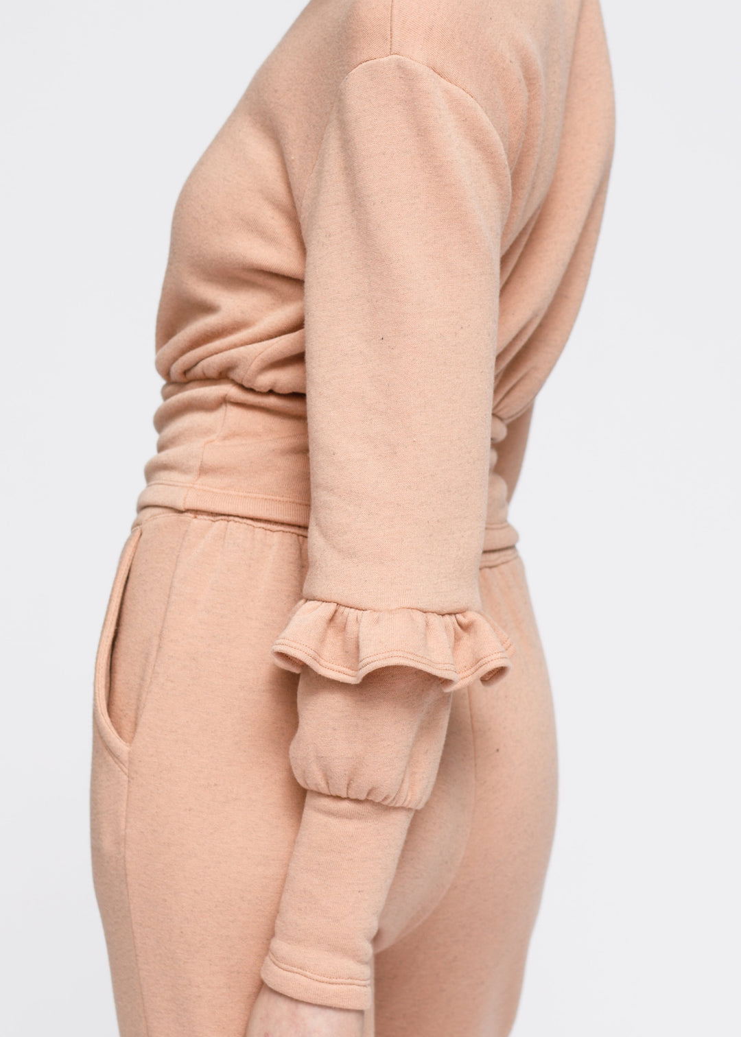 Crewneck Ruffle Sleeve Peplum Sweatshirt In Peach by Shop at Konus